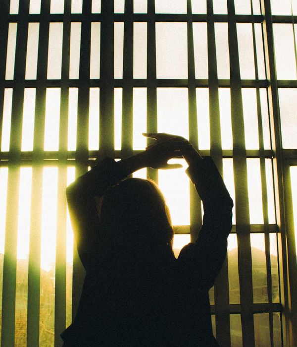 Woman in a calm yoga pose, embodying fluid movement.
